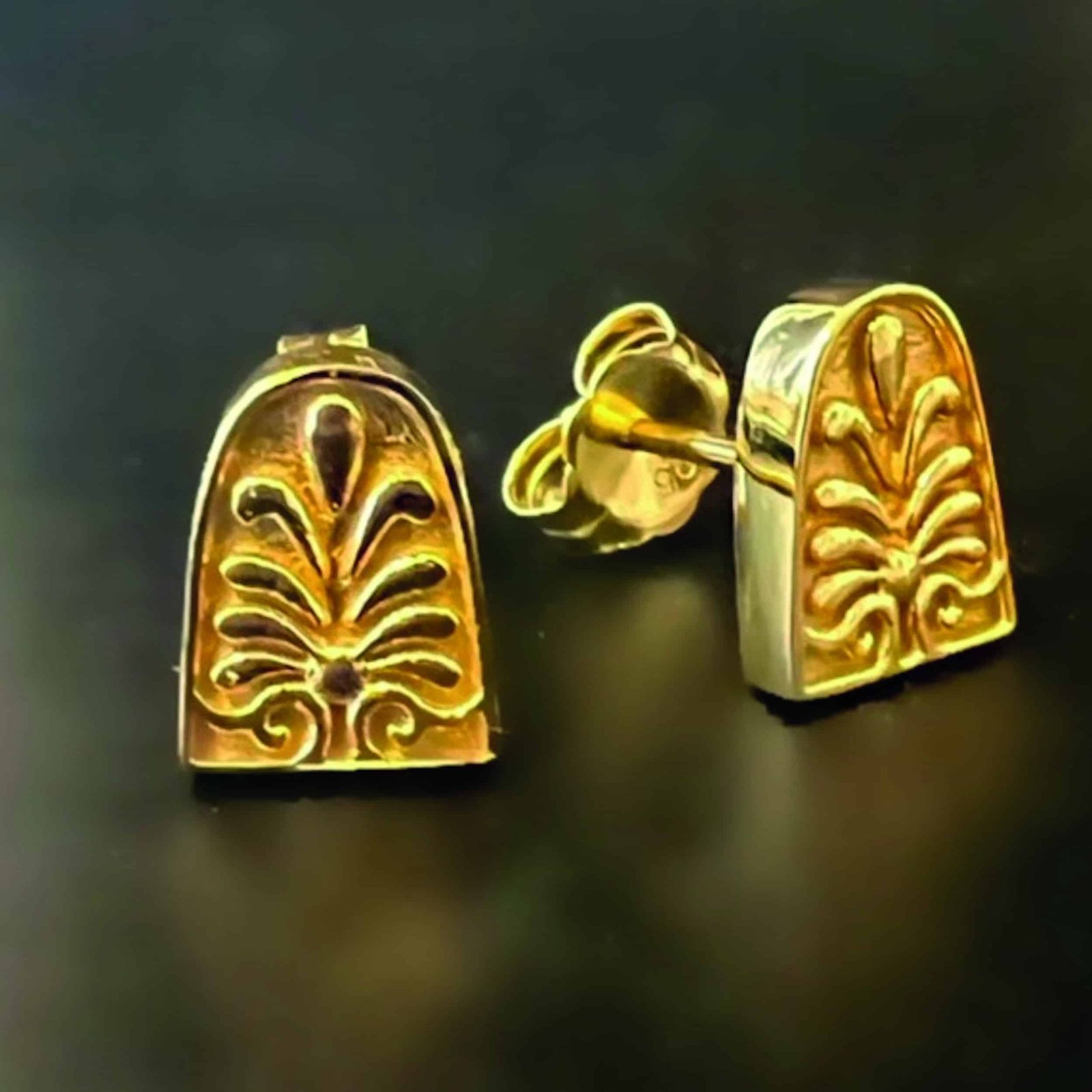 A pair of gold plated stud earrings imported from Rome.