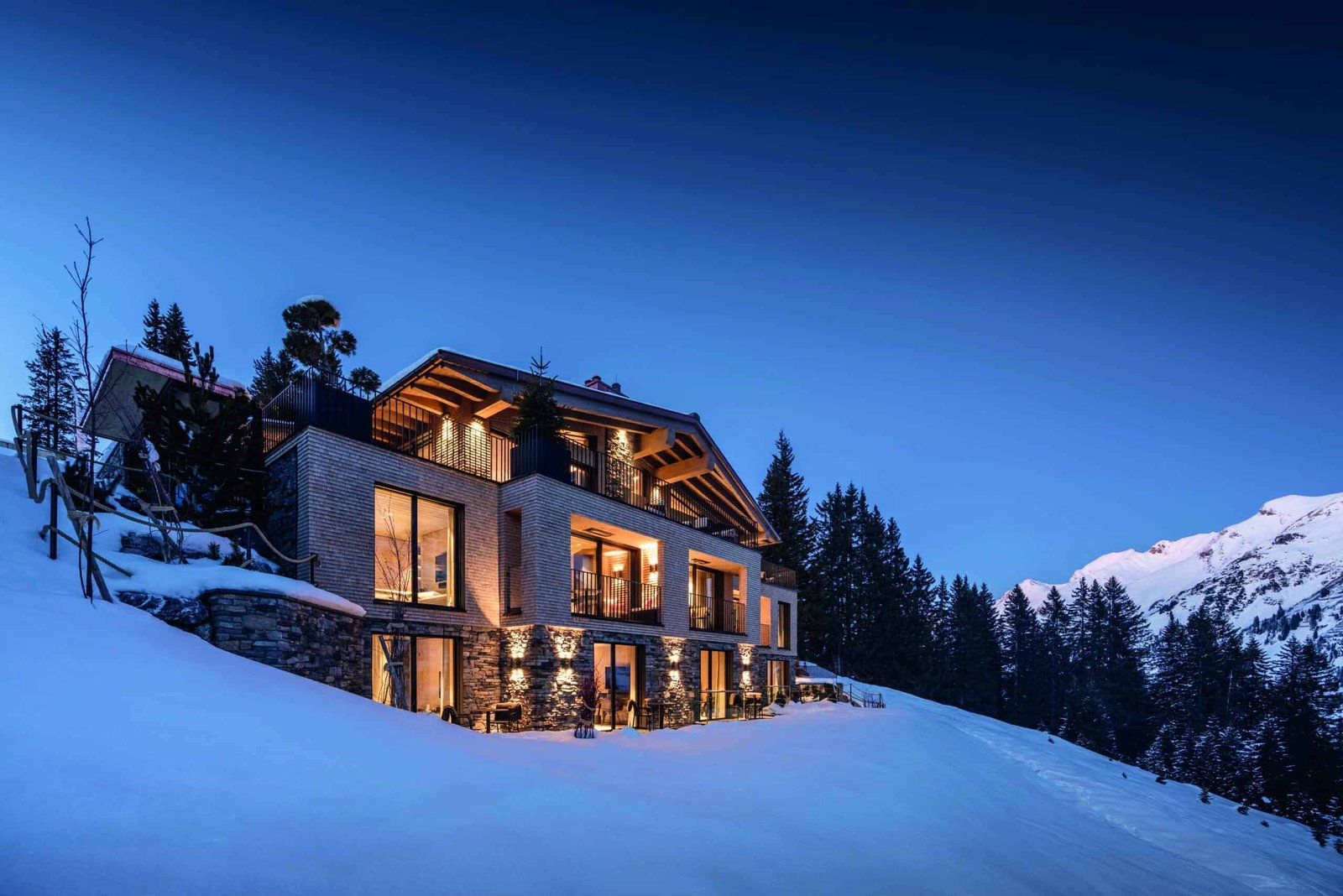 An experiential house nestled among the snowy mountain.
