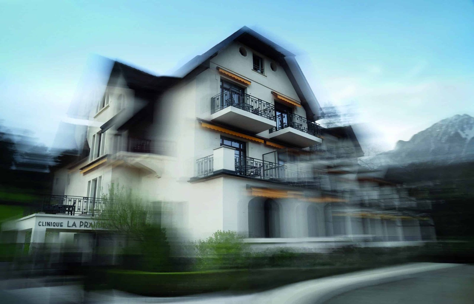 A blurry image of a house that captures the essence of life.