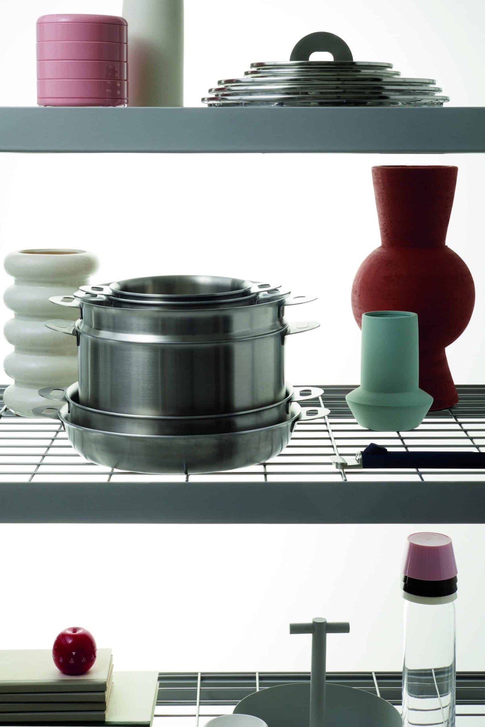 A shelf filled with an extensive selection of purposeful pots and pans.