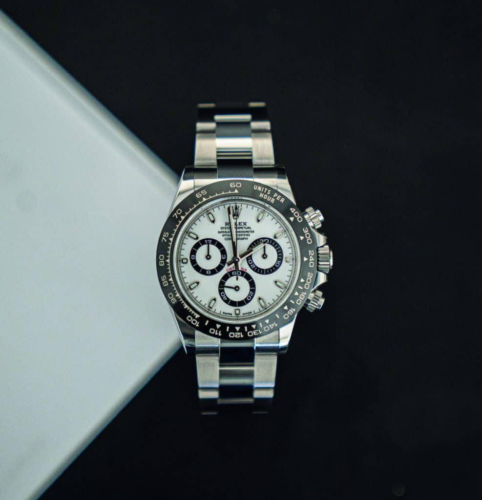 A Rolex Daytona watch arrives at the table, marking the cometh of its timeless hour.