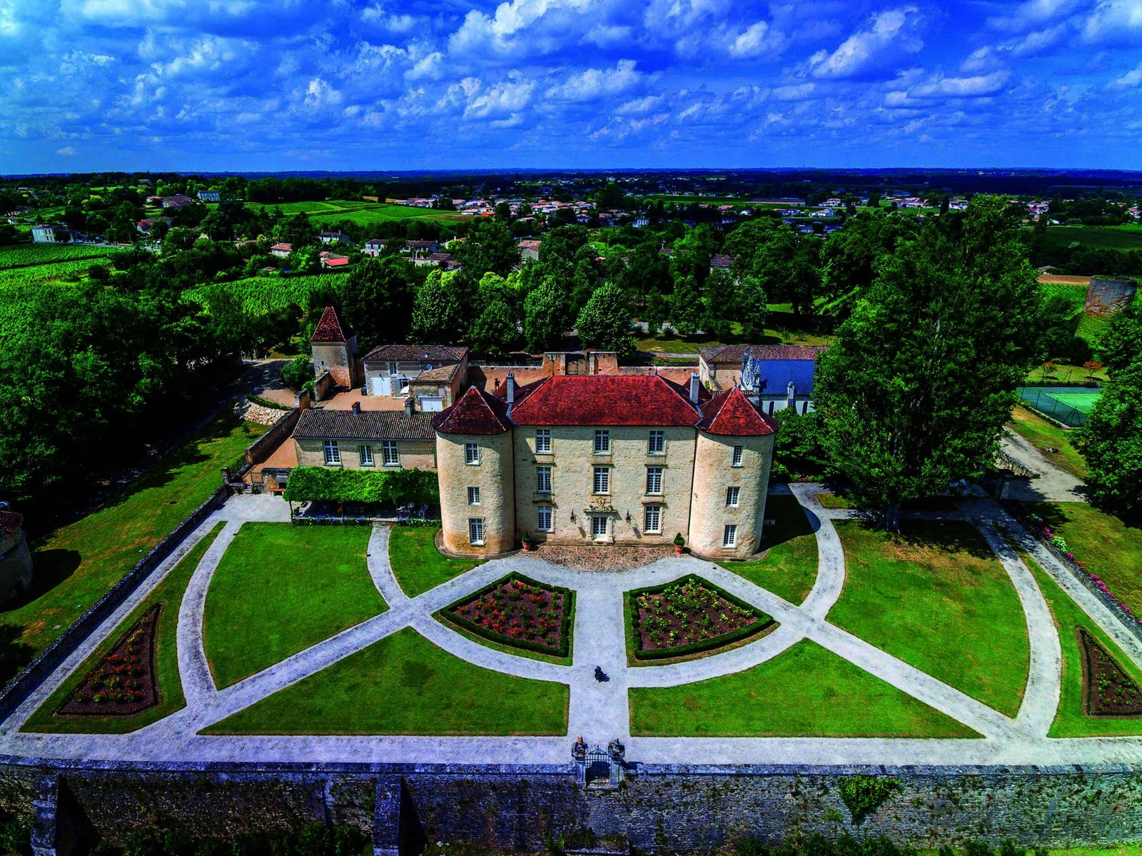 Using an aerial view, pick out the stunning features of a castle in France.