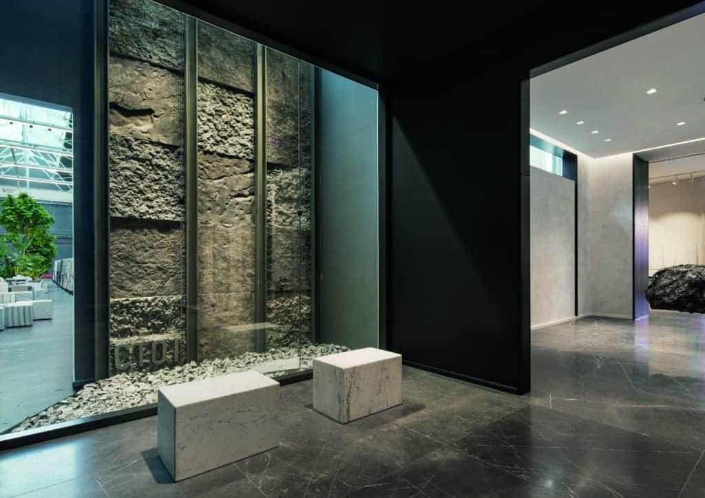 A room with an eco-friendly stone wall and sustainable stone floor, creating a harmonious space for an eco city.