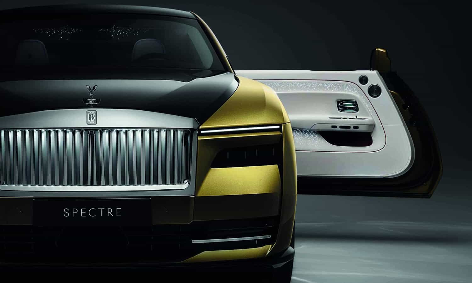 The Rolls Royce Spectre is showcased in a dimly lit room at the RREC Home.